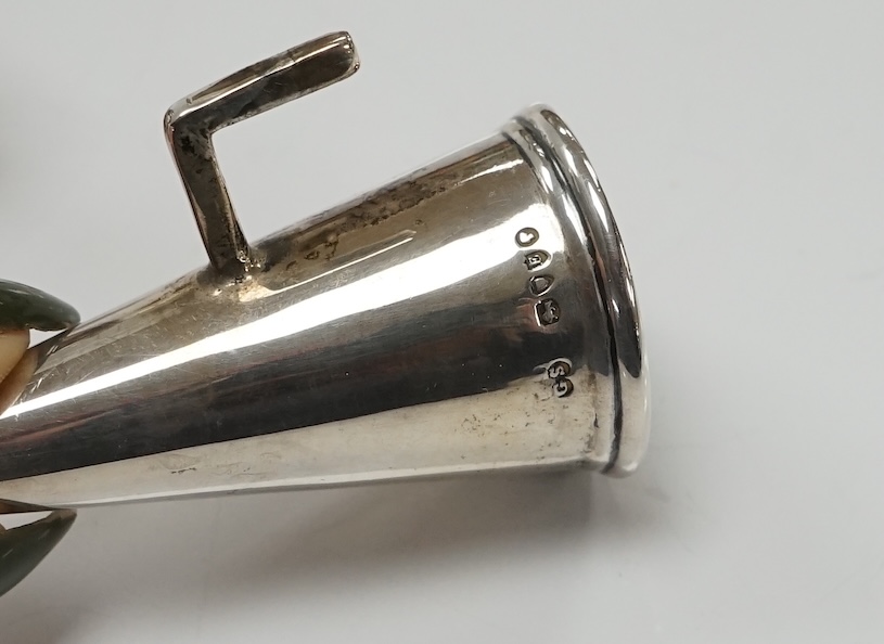 A Victorian silver chamberstick, Walker Knowles & Co, Sheffield, 1859, with later associated silver extinguisher, diameter 13.2cm. Condition - fair